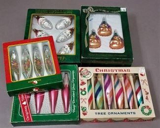 2 table of vintage ornaments and tree toppers