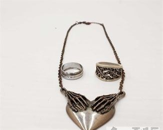 204: One Sterling Silver Ring and Costume Jewelry
This collection contains one sterling silver ring and costume Jewelry Everything together weighs approximately 10.1g Ring sizes are approx 8.5 and 9 
J2