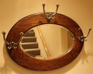 Oval oak hat holding mirror.