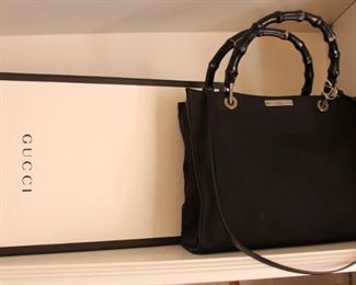 Gucci black with bamboo like handles.  