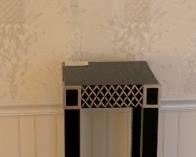 Vienna Regulator shown with designer table/pedestal.