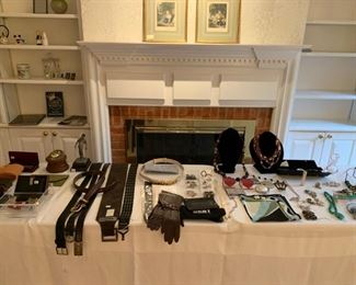 Our "goodie" table is full of jewelry, designer leather belts, Maitland Smith, kid gloves and more.  