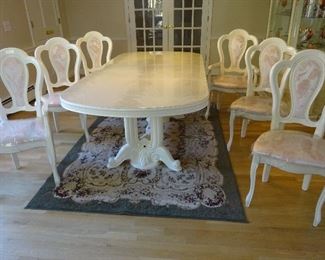 Different view of the dining set, showing the chairs more clearly than the prior picture.
