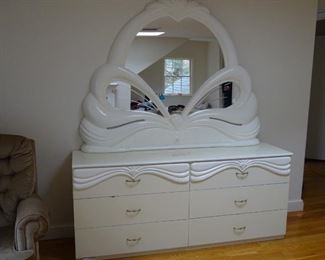 Dresser with 6 wide drawers. Entire set has a glossy finish and looks new. Matching set with queen bed.