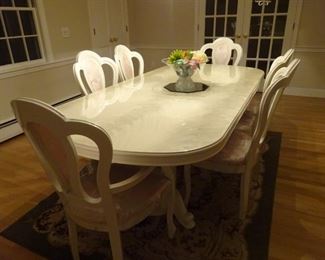 Glossy finished dining room set and 6 chairs. All look new. The table is extendable and can seat 2 more if needed.