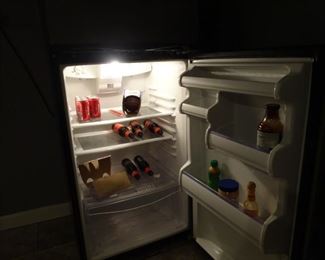 Inside of fridge with 3 shelves and plenty of space on the door