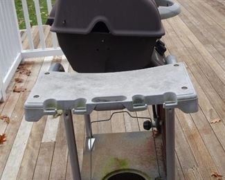 Side view of BBQ. The round hole is where the gas cylinder fits.