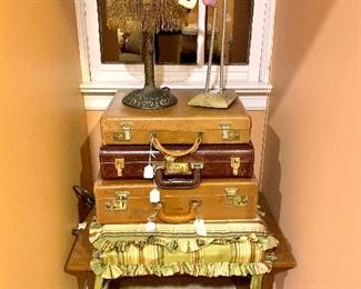 Vintage Suitcases...Deco lamp and funky folk art make this room a treat to enter.