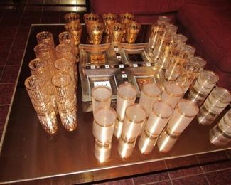 Nice selection of Mid Century 22K gold trimmed Barware