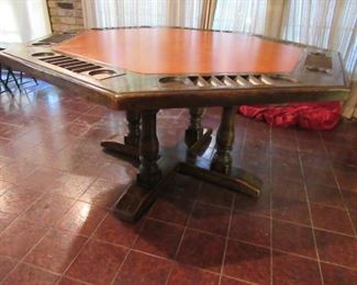 It has a custom made glass top to protect it if to be used as a dinner table.