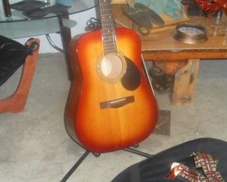 Greg Bennett series acoustic guitar w/case and shoulder strap. Music books available