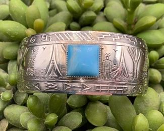 Vintage sterling silver and turquoise storyteller cuff bracelet with teepees and whirling logs, Native American