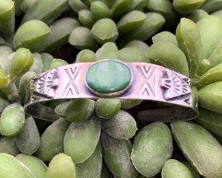 Vintage sterling silver and turquoise cuff bracelet with an arrowhead motif, Native American