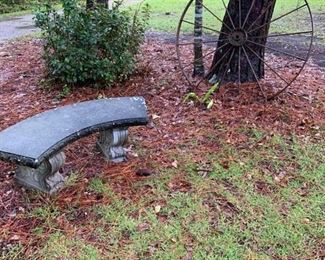 Several wagon wheels and outdoor benches