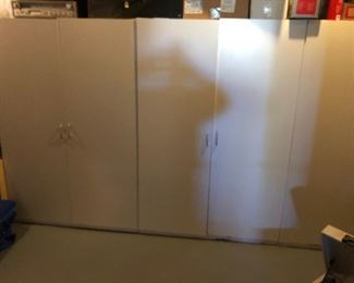 Large white storage cabinets