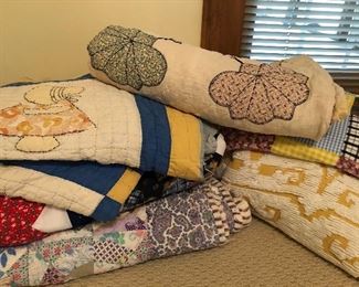 Antique hand sewn quilts and blankets