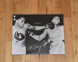 Muhammad Ali Vs. Joe Fraser double signed 16x20 fight photo with authenticity. 