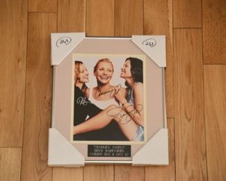 Charile's Angels triple signed film photo including, Cameron Diaz, Drew Barrymore, and Lucy Lui with authenticity.