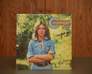 Olivia Newton John signed album with record and authenticity.