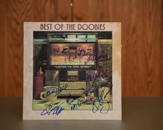 Doobie Brothers signed album, with record, by seven legends with authenticity. 