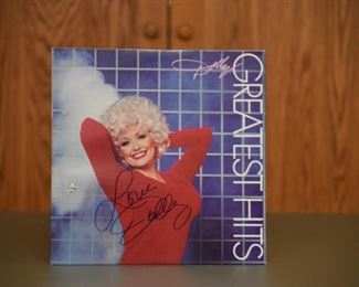 Dolly Parton signed album with record and authenticity.