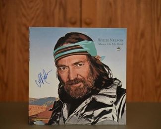 Willie Nelson signed album (no record) with authenticity. 