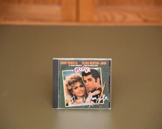 Olivia Newton John Grease signed CD with authenticity.