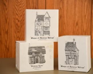 Set of 15 mint condition Dickens village hand painted shops and villages.