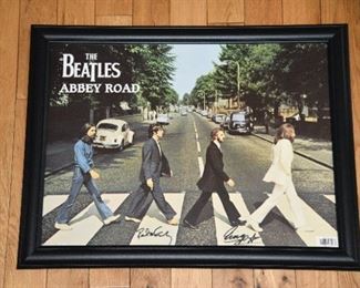 The Beatles Abbey Road poster signed by Paul McCartney and Ringo Starr with authenticity.
