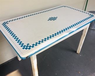 an early enameled kitchen table