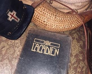 an 19th century Knights Templar fatigue hat, a 1914 SLI yearbook, and an early wicker hunting  carry bag