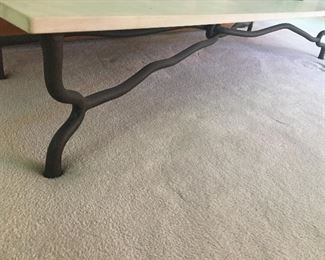 A long and low stone and wrought iron Accent Table. So unusual!