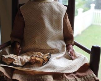 Early 19th century doll, composition shoulders and head, leather body, original costume