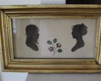 Painted silhouettes on cloth, with stenciled design, period frame