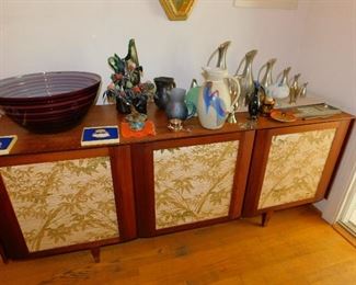 MCM Credenza with reversible front panels to solid wood.