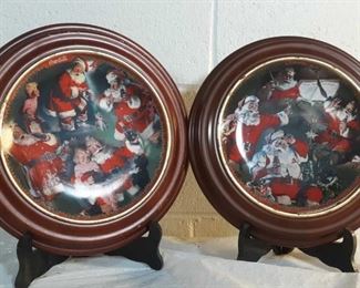 2 Coca Cola Holiday plates on wood stands