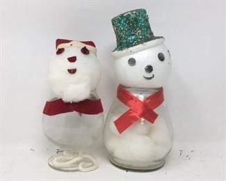 Handmade a snowmen out of glass vases
