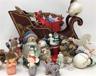 Collection of ornaments and 7” wooden sleigh
