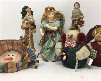 3 7” figurines along with 3” snowman candle and