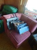 Part of the pink sectional sofa with vintage Pan Am Bag, Leather vintage brief cases.
