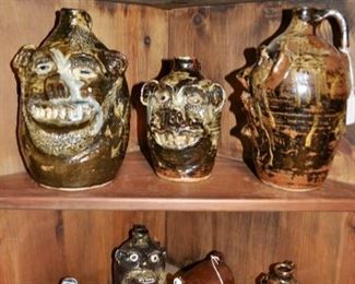 Corner shelves filled with Marie Rogers' (GA) pottery.
