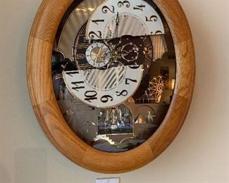 Wall clock with moving face and melodies. 