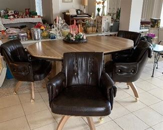 Formica table with barrel chairs. 
