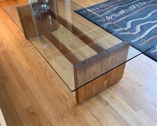Mid century modern glass and wood coffee table. 