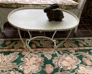 #17 metal oval coffee table on 4 legs and planet hole base  $ 30.00