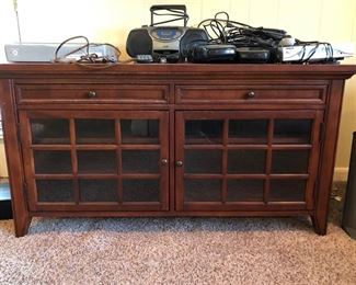 Hooker brand mahogany tv/entertainment stand w/ radio/CD player & other various electronic equipment.