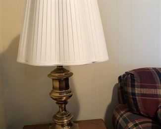 Another picture of one of two matching brass lamps w/ shades. Ceramic rabbit w/ small candle.