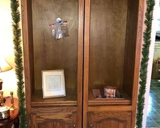 Two matching oak book shelves w/ lower cabinets.  Small framed print.