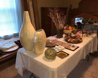 Oak coffee table & table filled w/ household decor items. 