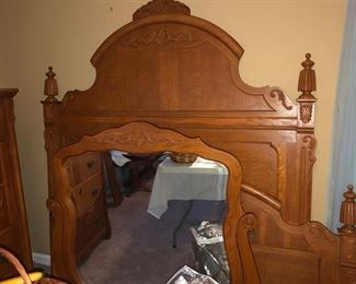 Oak queen size headboard & footboard w/ rails. Dresser mirror. 